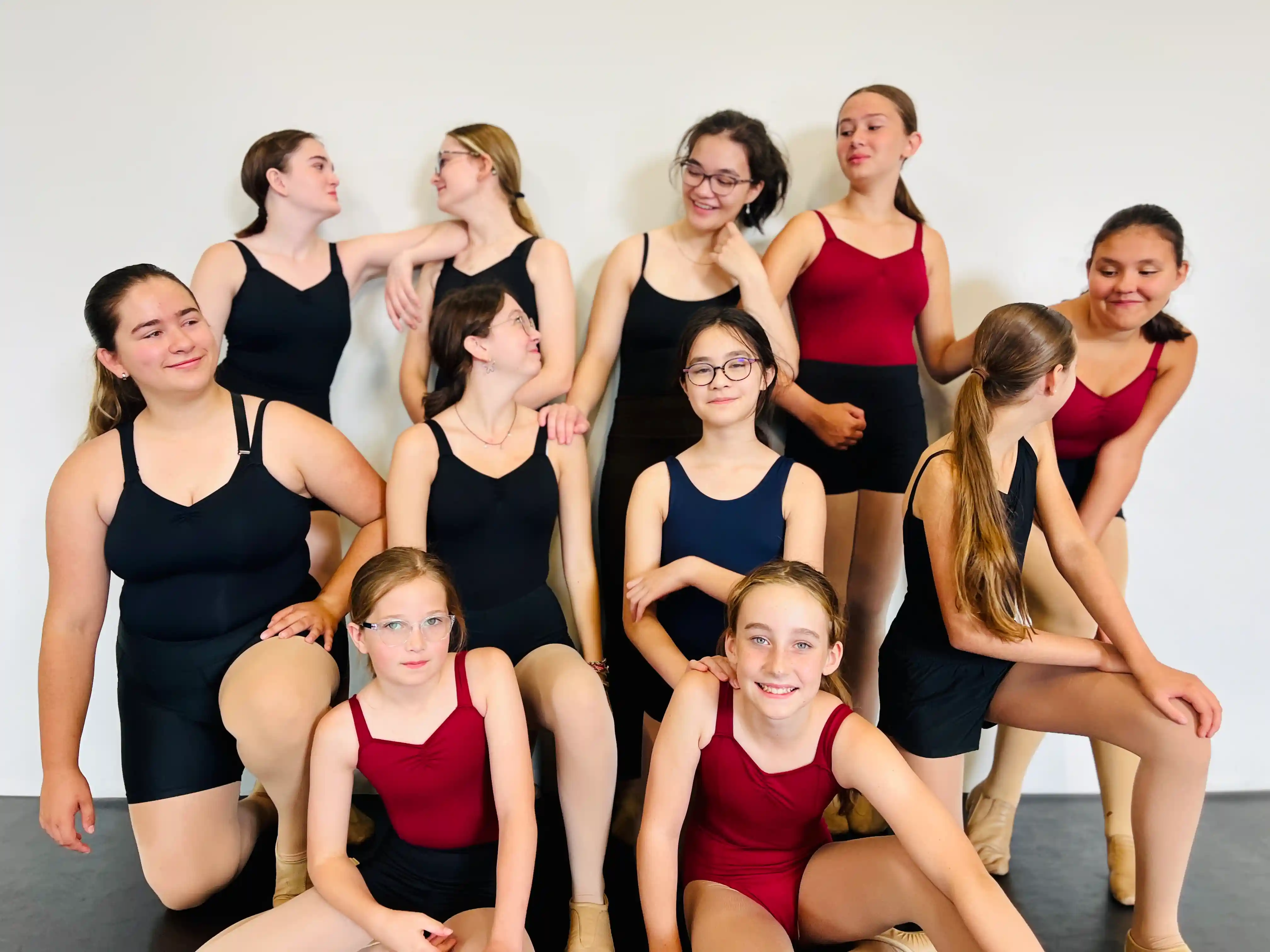 Group of ballet students posing together during class at Ark Dance Academy